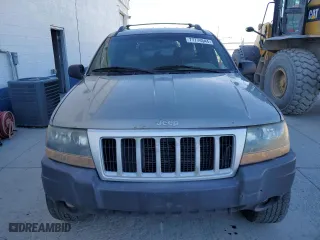1999 Jeep Grand Cherokee Laredo with VIN 1J4GW58N9XC730311, listed as a Copart auction lot 77774544 with 0 mi miles and Salvage Title. Bid and sale history available at carsss.com. Image 5.