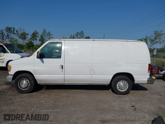 1999 Ford Econoline Cargo with VIN 1FTRE1420XHA34056, listed as a IAAI auction lot 41998411 with 236,267 mi miles. Bid and sale history available at carsss.com. Image 14.
