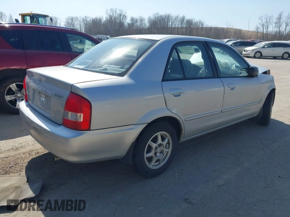 2000 Mazda Protege DX with VIN JM1BJ2227Y0240819, listed as a IAAI auction lot 41810228 with 68,650 mi miles and . Bid and sale history available at DreamBid. Image 4.