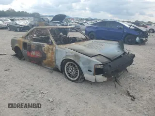 1986 Toyota MR2 z VIN JT2AW15CXG0066425, wystawiony jako Copart lot #74560234 z przebiegiem Nie podano mil oraz Nie do naprawy. Historia ofert i sprzedaży dostępna na DreamBid. Obrazek 4.