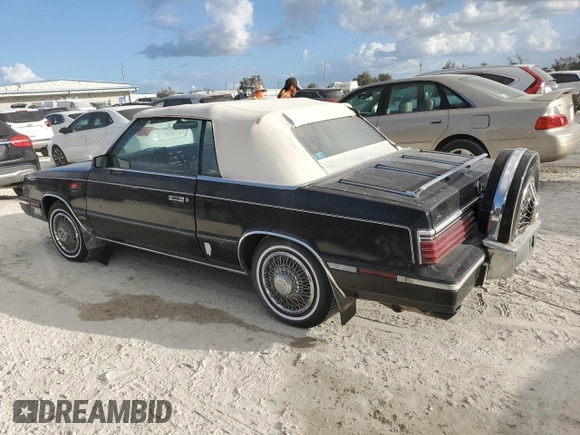 1985 Chrysler LeBaron Mark Cross z VIN 1C3BC55E0FG160918, wystawiony jako Copart lot #76659284 z przebiegiem Nie podano mil oraz Szkody całkowita. Historia ofert i sprzedaży dostępna na DreamBid. Obrazek 2.