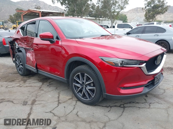 2018 Mazda CX-5 Grand Touring with VIN JM3KFADMXJ0302656, listed as a IAAI auction lot 42099173 with 125,378 mi miles and . Bid and sale history available at DreamBid. Image 1.