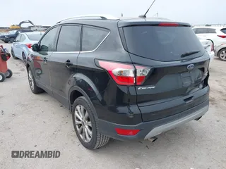 2017 Ford Escape Titanium with VIN 1FMCU0J93HUF10664, listed as a IAAI auction lot 41921588 with 88,377 mi miles. Bid and sale history available at carsss.com. Image 3.