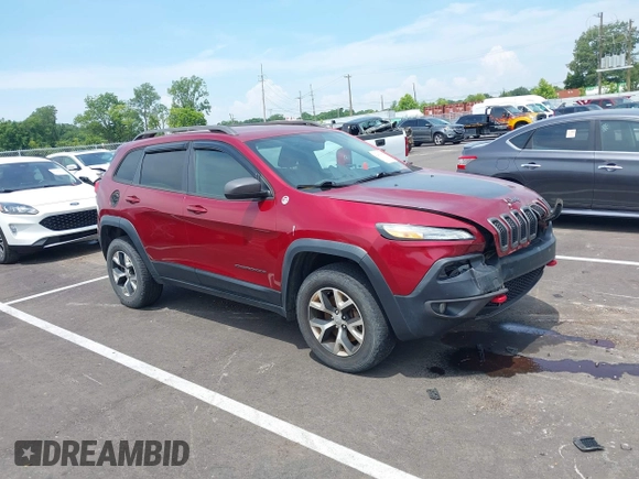2014 Jeep Cherokee Trailhawk with VIN 1C4PJMBS7EW162357, listed as a IAAI auction lot 42601903 with 104,768 mi miles and . Bid and sale history available at DreamBid. Image 1.