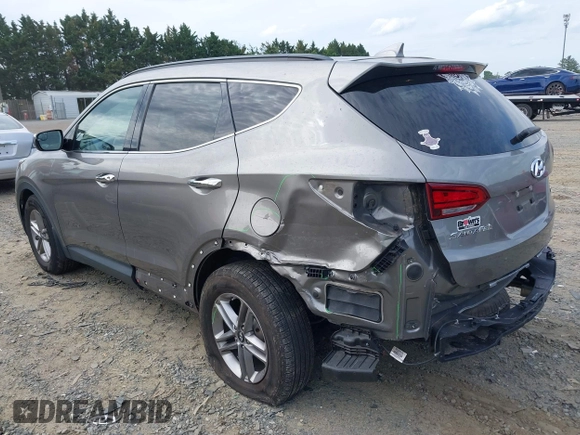 2018 Hyundai Santa Fe 2.4L z VIN 5NMZUDLB4JH073857, wystawiony jako IAAI lot #42200208 z przebiegiem 127 038 mil mil oraz . Historia ofert i sprzedaży dostępna na DreamBid. Obrazek 3.