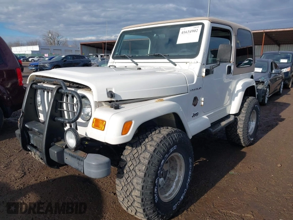 2002 Jeep Wrangler Sahara with VIN 1J4FA59S02P760345, listed as a IAAI auction lot 41634902 with 123,506 mi miles. Bid and sale history available at carsss.com. Image 2.