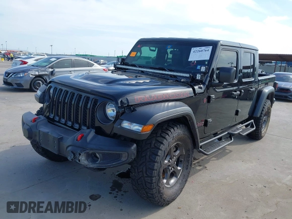 2021 Jeep Gladiator Rubicon z VIN 1C6JJTBG6ML535939, wystawiony jako IAAI lot #42260764 z przebiegiem 114 060 mil mil oraz . Historia ofert i sprzedaży dostępna na DreamBid. Obrazek 19.