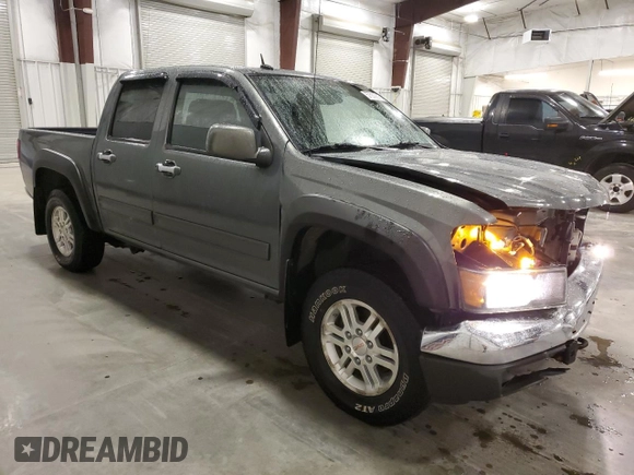 2010 GMC Canyon SLE1 with VIN 1GTJTCDE5A8148716, listed as a Copart auction lot 57559215 with 126,523 mi miles and Salvage title. Bid and sale history available at DreamBid. Image 4.