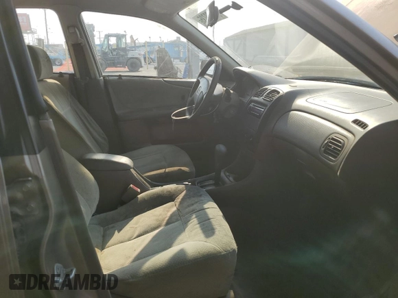 1999 Mazda Protege DX z VIN JM1BJ2223X0137153, wystawiony jako Copart lot #87899735 z przebiegiem 154 209 mil mil oraz Szkoda całkowita • Salvage title. Historia ofert i sprzedaży dostępna na DreamBid. Obrazek 7.