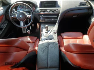 2015 BMW M6 z VIN WBS6C9C5XFD467711, wystawiony jako Copart lot #66574644 z przebiegiem 101 001 mil mil oraz Szkody całkowita. Historia ofert i sprzedaży dostępna na DreamBid. Obrazek 8.