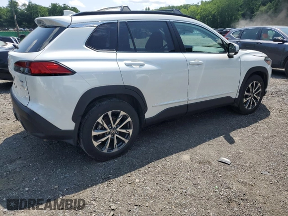 2023 Toyota Corolla Cross XLE with VIN 7MUDAABGXPV060797, listed as a Copart auction lot 62110665 with 18,293 mi miles and Salvage title. Bid and sale history available at DreamBid. Image 3.