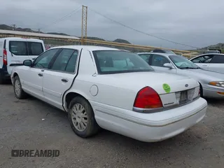 2003 Ford Crown Victoria LX z VIN 2FAFP74WX3X154904, wystawiony jako IAAI lot #42094274 z przebiegiem 123 579 mil mil oraz . Historia ofert i sprzedaży dostępna na DreamBid. Obrazek 3.