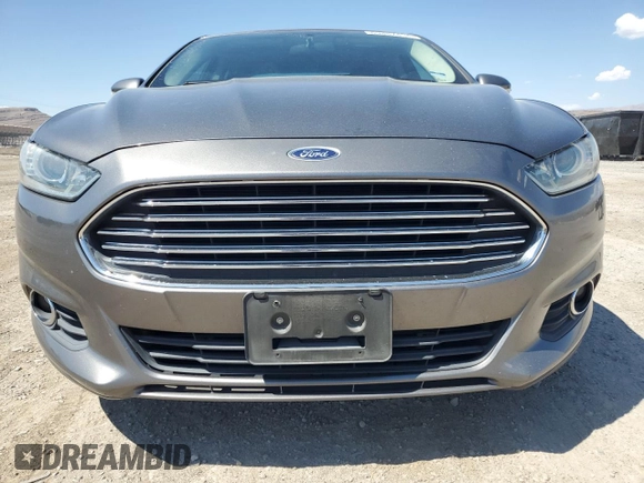 2014 Ford Fusion SE Hybrid with VIN 3FA6P0LU3ER306739, listed as a Copart auction lot 69887454 with 114,150 mi miles and Salvage title. Bid and sale history available at DreamBid. Image 5.