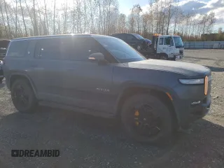 2022 Rivian R1S Launch Edition with VIN 7PDSGABL1NN000514, listed as a Copart auction lot 77444184 with 29,490 mi miles and Salvage Title. Bid and sale history available at DreamBid. Image 4.