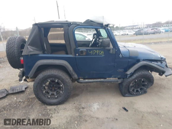 2003 Jeep Wrangler X with VIN 1J4FA39S23P300447, listed as a IAAI auction lot 41791733 with 165,576 mi miles. Bid and sale history available at carsss.com. Image 13.