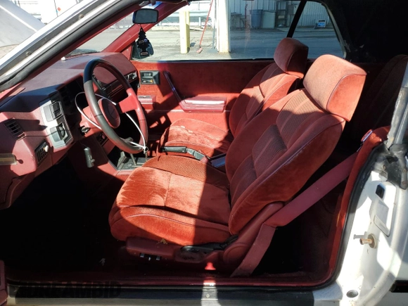 1986 Chevrolet Cavalier with VIN 1G1JE67W3G7172570, listed as a Copart auction lot 87169464 with 173,529 mi miles and Clean Title. Bid and sale history available at DreamBid. Image 7.
