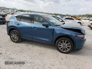 2019 Mazda CX-5 Grand Touring with VIN JM3KFADM1K1600329, listed as a Copart auction lot 51807165 with 51,579 mi miles and Salvage Title. Bid and sale history available at carsss.com. Image 4.