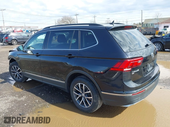 2020 Volkswagen Tiguan SE with VIN 3VV2B7AX5LM091857, listed as a IAAI auction lot 41922727 with 83,464 mi miles and . Bid and sale history available at DreamBid. Image 3.