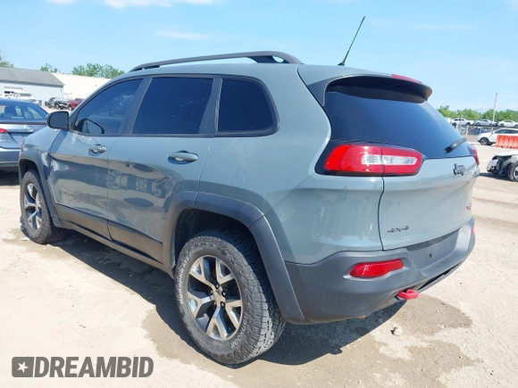 2014 Jeep Cherokee Trailhawk z VIN 1C4PJMBSXEW273520, wystawiony jako IAAI lot #42569063 z przebiegiem 137 585 mil mil oraz . Historia ofert i sprzedaży dostępna na DreamBid. Obrazek 3.