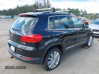 2012 Volkswagen Tiguan SE with VIN WVGBV7AX5CW561368, listed as a IAAI auction lot 42197389 with 63,809 mi miles and . Bid and sale history available at DreamBid. Image 4.