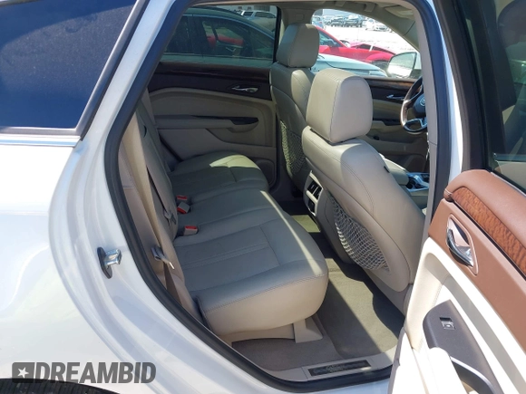 2014 Cadillac SRX Performance Collection with VIN 3GYFNFE35ES582897, listed as a IAAI auction lot 41978361 with 144,116 mi miles and . Bid and sale history available at DreamBid. Image 8.
