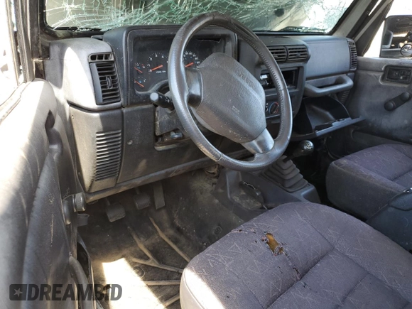 2002 Jeep Wrangler Sport with VIN 1J4FA49S42P720277, listed as a Copart auction lot 55856135 with Not provided miles and Salvage title. Bid and sale history available at DreamBid. Image 8.