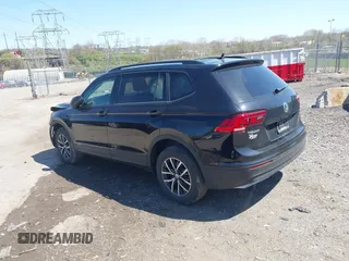 2021 Volkswagen Tiguan S with VIN 3VV0B7AXXMM040752, listed as a IAAI auction lot 41988353 with 51,757 mi miles and . Bid and sale history available at DreamBid. Image 3.
