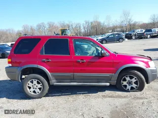 2004 Ford Escape XLT with VIN 1FMCU931X4KB19738, listed as a IAAI auction lot 41925561 with 220,674 mi miles. Bid and sale history available at carsss.com. Image 13.