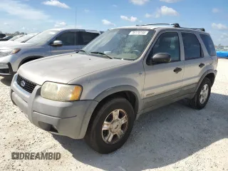 2001 Ford Escape XLT with VIN 1FMCU04101KF61126, listed as a Copart auction lot 76174744 with 0 mi miles and Salvage Title. Bid and sale history available at carsss.com. Image 1.