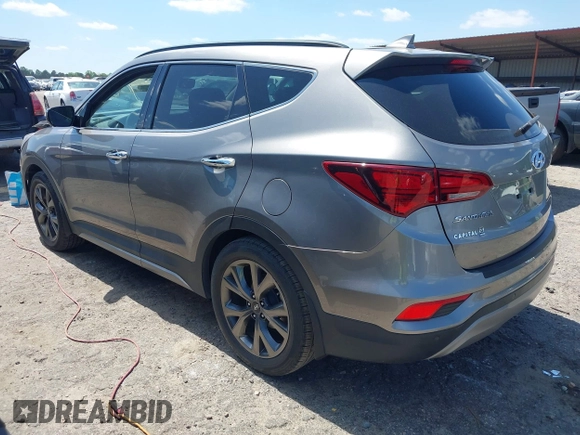 2017 Hyundai Santa Fe Ultimate z VIN 5NMZW4LA7HH047989, wystawiony jako IAAI lot #42051500 z przebiegiem 75 747 mil mil oraz . Historia ofert i sprzedaży dostępna na DreamBid. Obrazek 3.