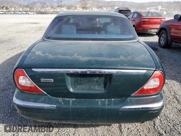 2004 Jaguar XJ with VIN SAJWA71C34SG29498, listed as a Copart auction lot 42653715 with 116,956 mi miles and Salvage Title. Bid and sale history available at carsss.com. Image 6.
