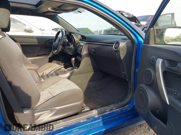 2014 Scion tC with VIN JTKJF5C72E3086001, listed as a IAAI auction lot 41721986 with 207,239 mi miles. Bid and sale history available at carsss.com. Image 5.