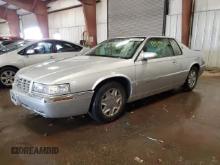 1999 Cadillac Eldorado z VIN 1G6EL12Y1XU611974, wystawiony jako Copart lot #71761494 z przebiegiem 139 494 mil mil oraz Czysty tytuł • Clean title. Historia ofert i sprzedaży dostępna na DreamBid. Obrazek 1.