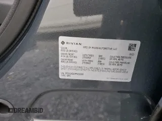 2023 Rivian R1S Launch Edition z VIN 7PDSGABL9PN022280, wystawiony jako Copart lot #83526124 z przebiegiem 51 mil mil oraz Szkoda całkowita • Salvage title. Historia ofert i sprzedaży dostępna na DreamBid. Obrazek 13.