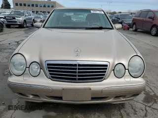 2000 Mercedes-Benz E-Class with VIN WDBJF82J0YX040071, listed as a Copart auction lot 50001165 with 145,638 mi miles and Salvage Title. Bid and sale history available at carsss.com. Image 5.
