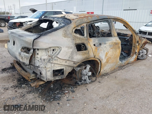 2020 BMW X4 xDrive30i with VIN 5UX2V1C00L9B30132, listed as a IAAI auction lot 41769464 with Not provided miles and . Bid and sale history available at DreamBid. Image 4.