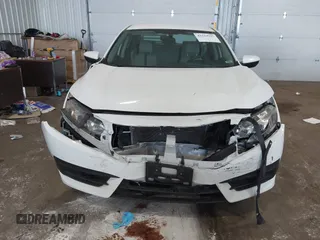 2017 Honda Civic LX with VIN 19XFC2F5XHE007668, listed as a IAAI auction lot 42219927 with 132,444 mi miles and . Bid and sale history available at DreamBid. Image 6.