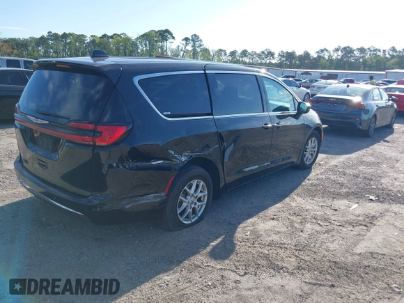 2023 Chrysler Pacifica Touring L with VIN 2C4RC1BG1PR606566, listed as a IAAI auction lot 42615498 with 42,980 mi miles and . Bid and sale history available at DreamBid. Image 4.