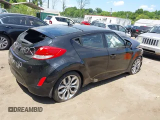 2013 Hyundai Veloster w/Black Int with VIN KMHTC6AD5DU164900, listed as a IAAI auction lot 36770576 with 106,253 mi miles and . Bid and sale history available at DreamBid. Image 4.