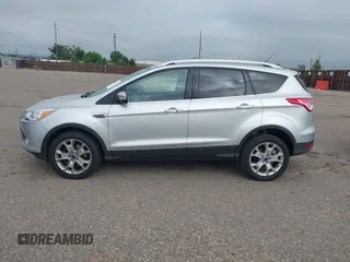 2016 Ford Escape Titanium with VIN 1FMCU9JX3GUC86930, listed as a IAAI auction lot 42582263 with 113,386 mi miles and . Bid and sale history available at DreamBid. Image 14.