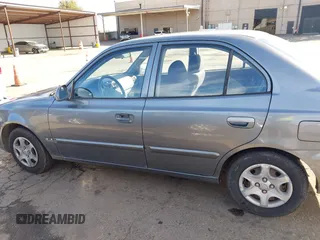 2004 Hyundai Accent GL with VIN KMHCG45C04U531177, listed as a IAAI auction lot 41526033 with 126,102 mi miles. Bid and sale history available at carsss.com. Image 14.