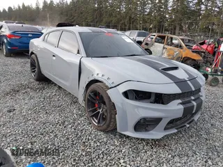 2021 Dodge Charger Scat Pack Widebody with VIN 2C3CDXGJ5MH597970, listed as a IAAI auction lot 40673227 with 32,720 mi miles. Bid and sale history available at carsss.com. Image 1.