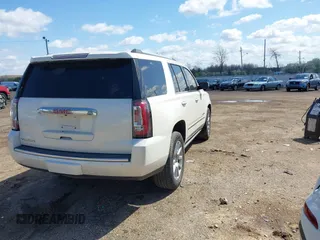 2015 GMC Yukon Denali with VIN 1GKS1CKJ5FR285199, listed as a IAAI auction lot 41763187 with 135,265 mi miles. Bid and sale history available at carsss.com. Image 4.