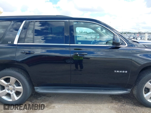 2015 Chevrolet Tahoe LT with VIN 1GNSCBKCXFR214072, listed as a IAAI auction lot 40512435 with 98,955 mi miles and . Bid and sale history available at DreamBid. Image 14.