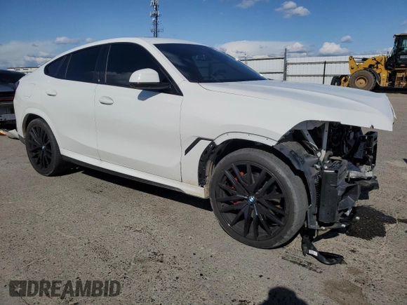 2023 BMW X6 xDrive40i z VIN 5UXCY6C04P9P49005, wystawiony jako Copart lot #51974695 z przebiegiem 30 421 mil mil oraz Szkoda całkowita • Salvage title. Historia ofert i sprzedaży dostępna na DreamBid. Obrazek 4.