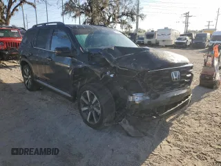 2023 Honda Pilot Touring with VIN 5FNYG2H77PB006594, listed as a Copart auction lot 83662854 with 37,637 mi miles and Salvage Title. Bid and sale history available at DreamBid. Image 4.
