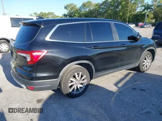 2021 Honda Pilot EX-L with VIN 5FNYF5H55MB044677, listed as a IAAI auction lot 42038704 with 38,684 mi miles and . Bid and sale history available at carsss.com. Image 4.