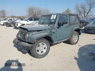 2014 Jeep Wrangler Sport with VIN 1C4AJWAG5EL271318, listed as a IAAI auction lot 41780040 with 128,942 mi miles and . Bid and sale history available at DreamBid. Image 2.