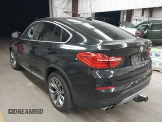 2015 BMW X4 xDrive28i z VIN 5UXXW3C59F0M87082, wystawiony jako IAAI lot #41839047 z przebiegiem 142 081 mil mil oraz . Historia ofert i sprzedaży dostępna na DreamBid. Obrazek 3.