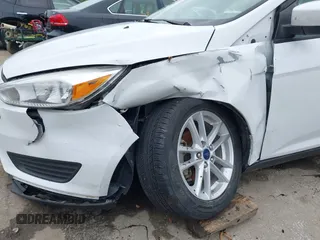 2018 Ford Focus SE with VIN 1FADP3F29JL223389, listed as a IAAI auction lot 42127707 with 87,145 mi miles and . Bid and sale history available at DreamBid. Image 6.